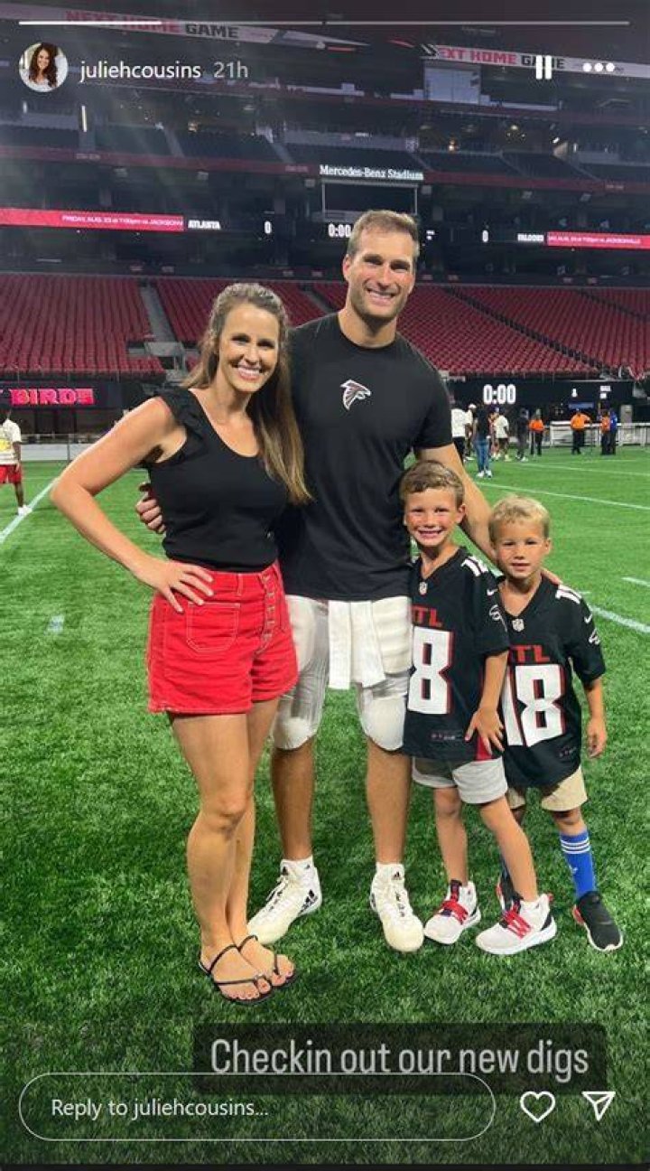 Kirk Cousins posing with his GMC van.