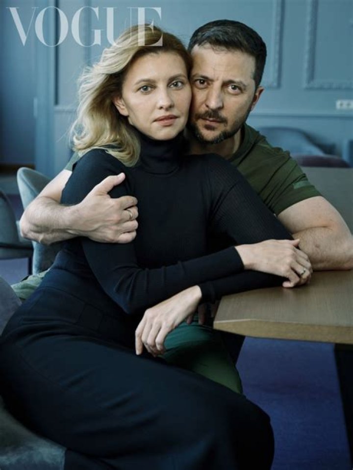 Olena Zelenska posing with her husband by wearing yellow sweater.